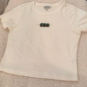 Super soft baby tee with embroidered three olives.